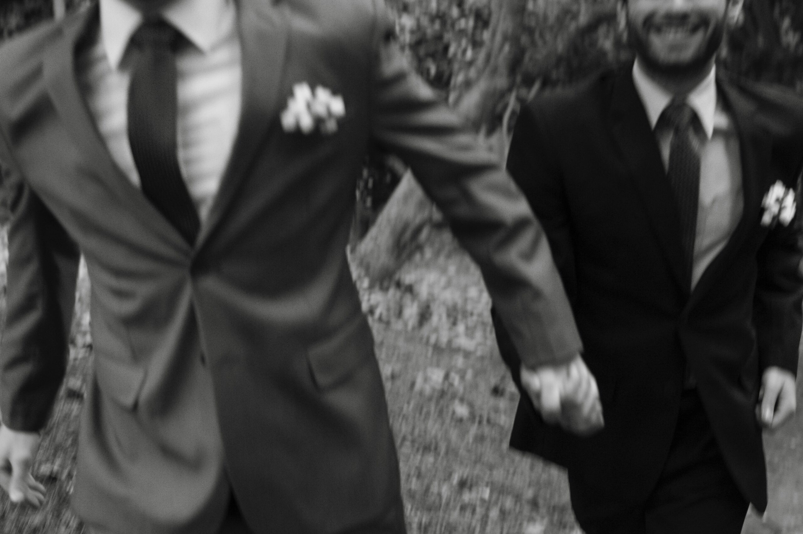 Happy groom and groom running on their wedding day. Mitzi Schwarz - Wedding Officiant